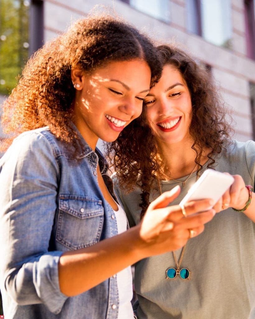girls looking phone